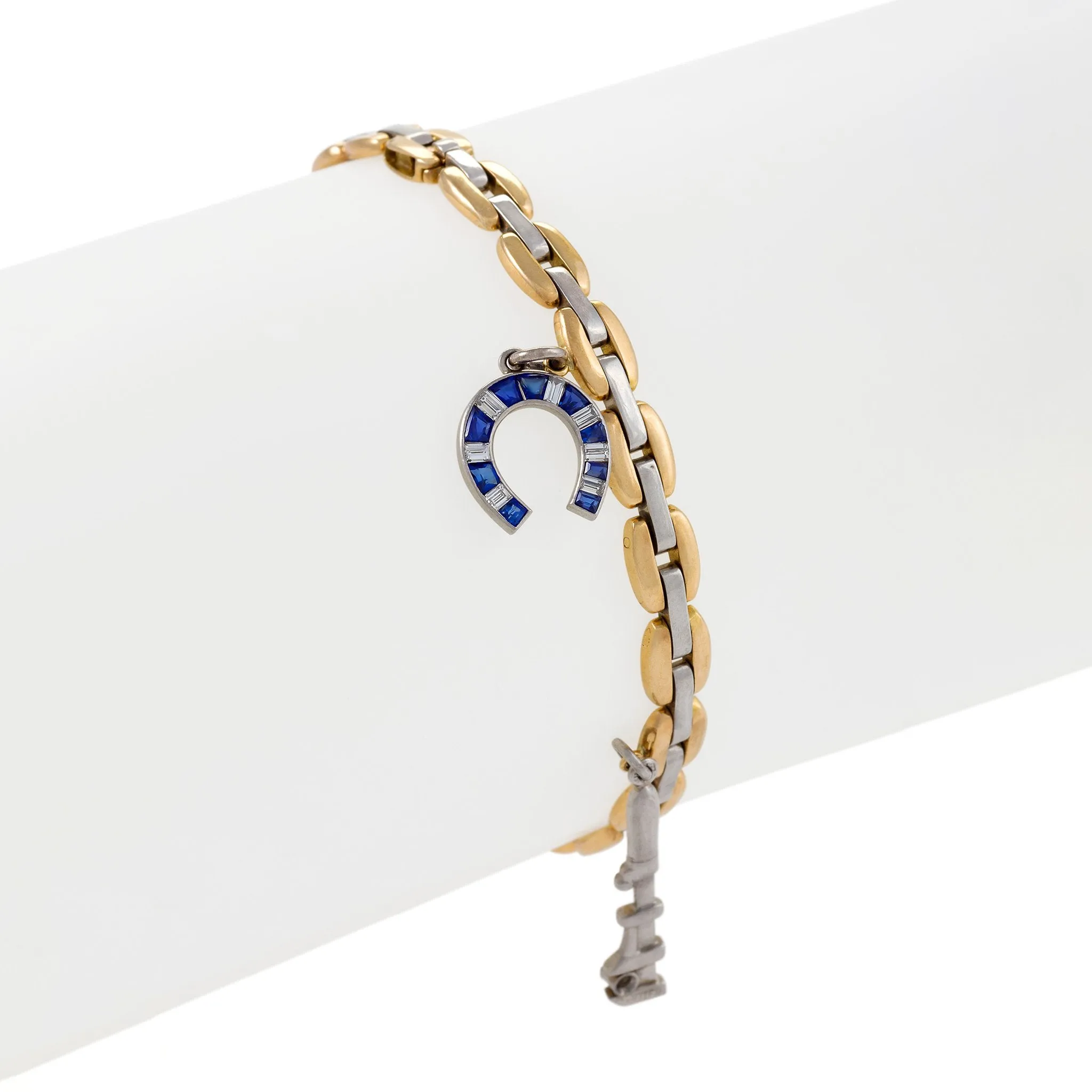 Cartier Gold and Platinum Link Gem-Set Charm Bracelet