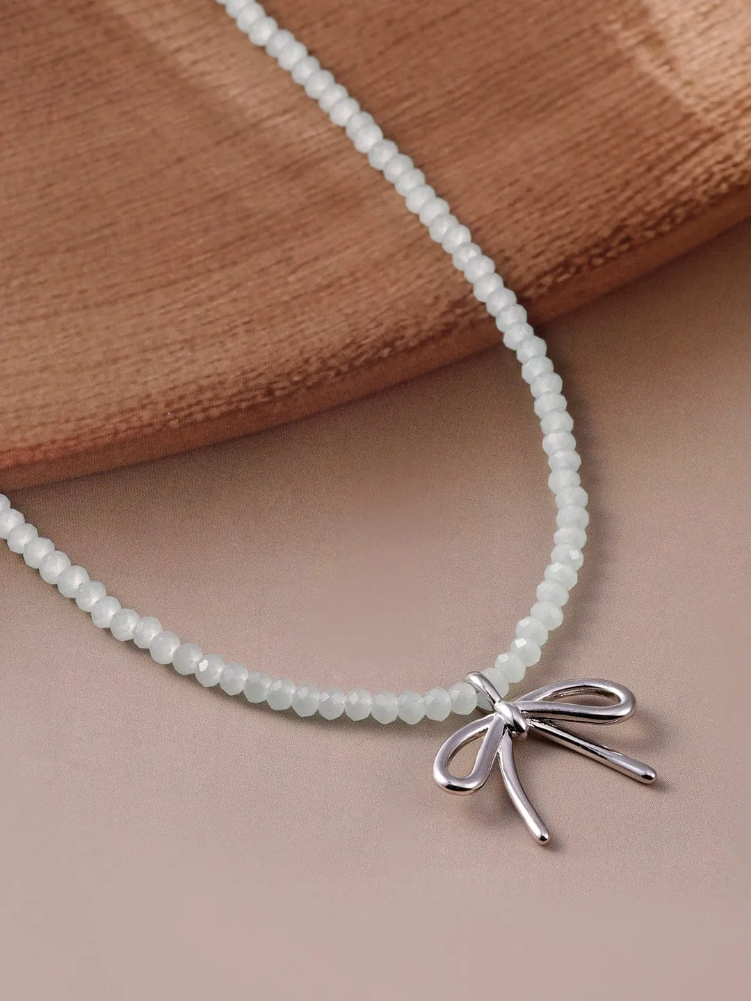 Silver Bow Pendant with White Bead Necklace