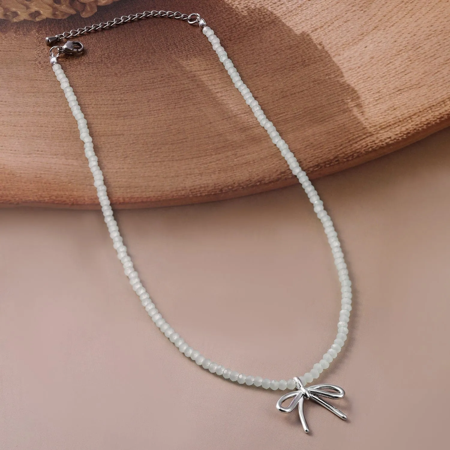 Silver Bow Pendant with White Bead Necklace